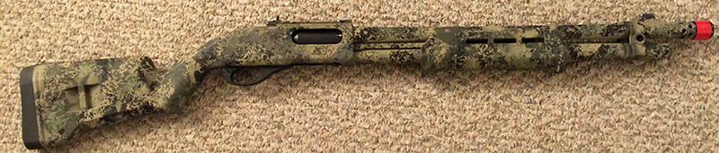 Remington 870 with breacher choke and red cap
